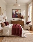 Sunrise Ruby framed canvas print in a light-filled bedroom