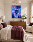 Bold framed canvas print in a light editorial bedroom