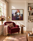 Sunrise Ruby framed canvas print in a light-filled reading nook